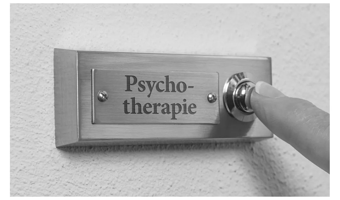 Foto van een vinger op de deurbel van een praktijk voor psychotherapie.