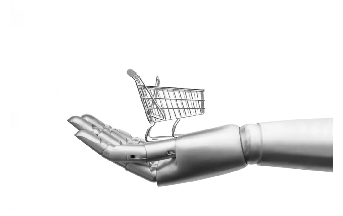 Afbeelding van een robothand met een winkelwagentje erop.